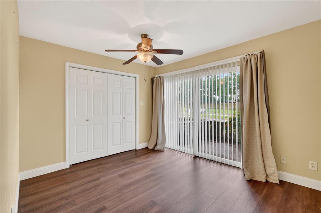4549 North O'Connor Road, Unit 1262 Irving, TX 75062 - Photo 15 of 21 a view of a livingroom with wooden floor and a ceiling fan