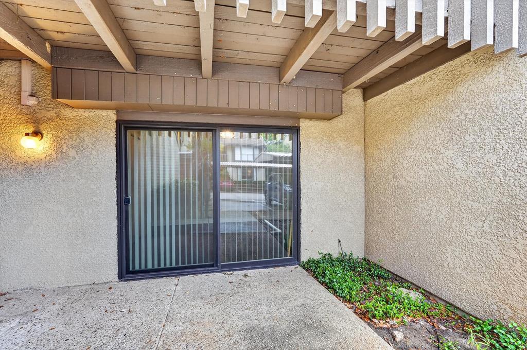 4549 North O'Connor Road, Unit 1262 Irving, TX 75062 - Photo 19 of 21 a view of entryway with a wooden fence