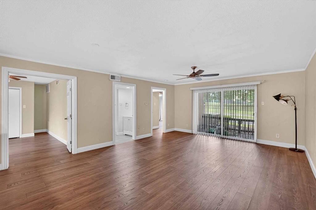 4549 North O'Connor Road, Unit 1262 Irving, TX 75062 - Photo 4 of 21 wooden floor in an empty room with a window