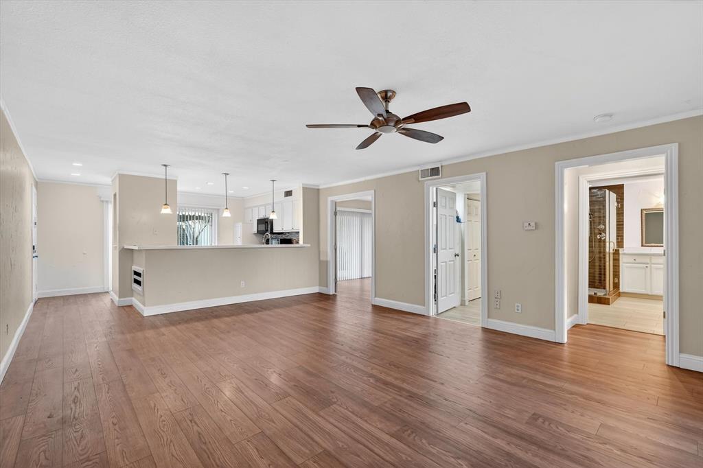 4549 North O'Connor Road, Unit 1262 Irving, TX 75062 - Photo 5 of 21 a view of a kitchen with a dishwasher and wooden floor