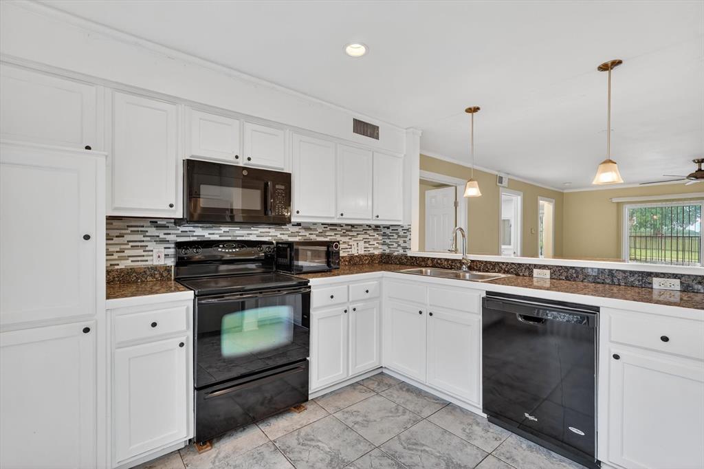 4549 North O'Connor Road, Unit 1262 Irving, TX 75062 - Photo 7 of 21 a kitchen with a sink stove and microwave