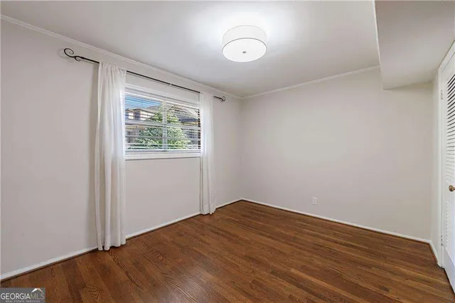 a kitchen with a sink a stove and cabinets