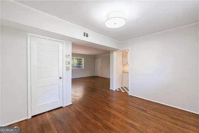 a bathroom with a bathtub shower sink vanity mirror and toilet