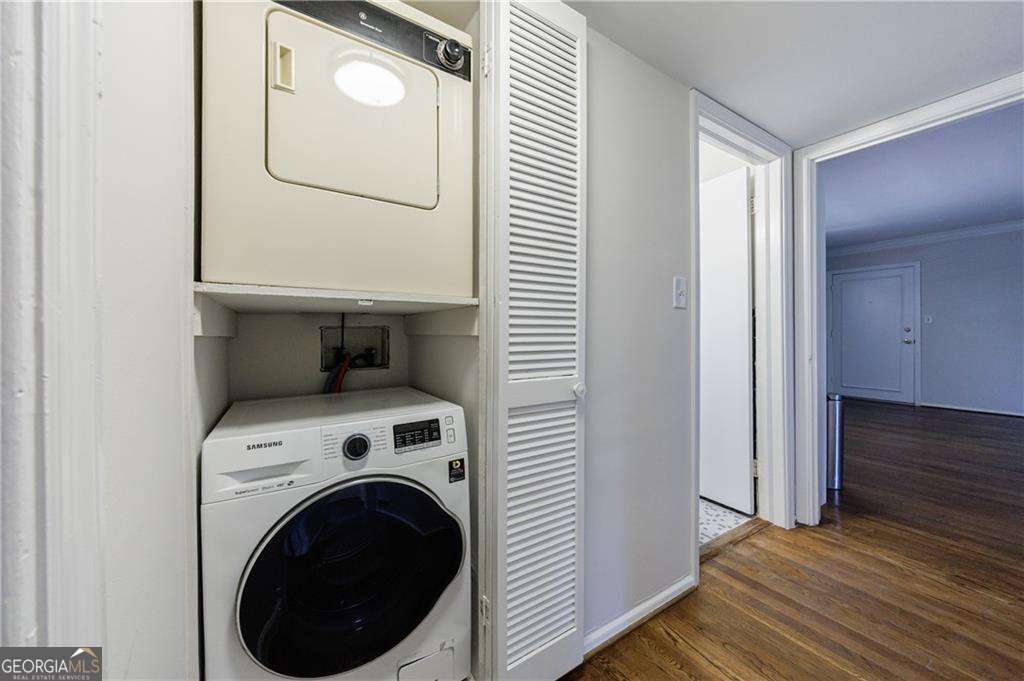 3660 Peachtree Road Northeast, Unit 2H Atlanta, GA 30319 - Photo 21 of 56 a view of a hallway with washer and dryer