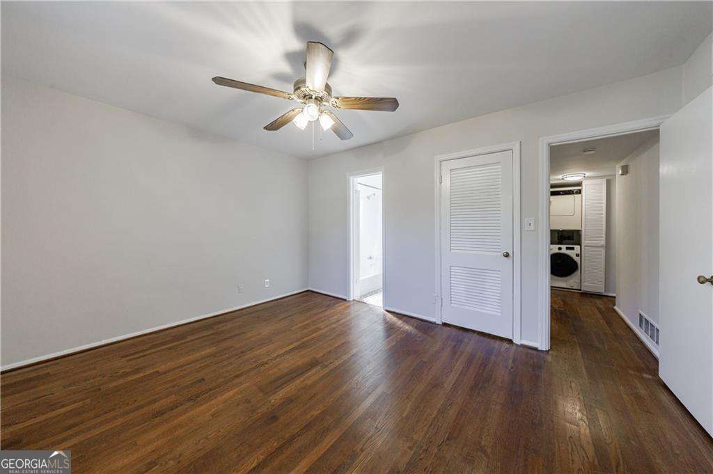 3660 Peachtree Road Northeast, Unit 2H Atlanta, GA 30319 - Photo 27 of 56 a view of an empty room with wooden floor