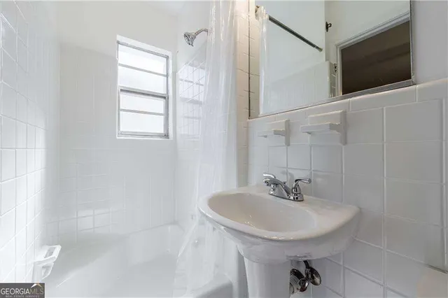 a view of a swimming pool with a lounge chair