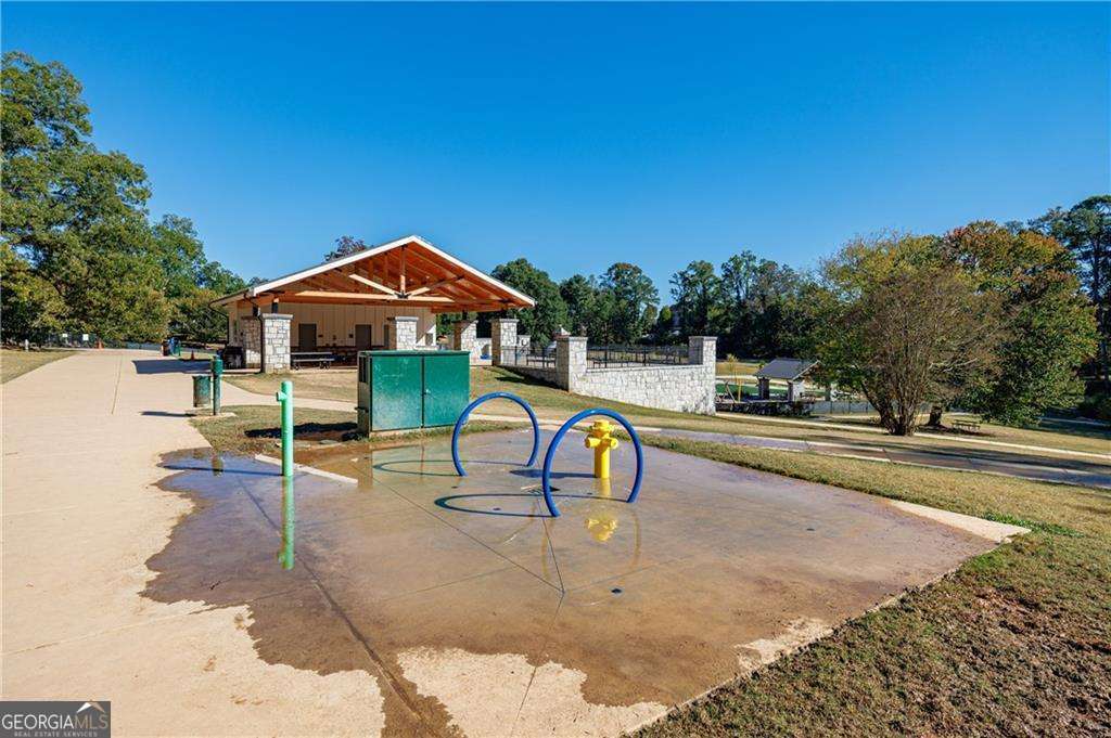 3660 Peachtree Road Northeast, Unit 2H Atlanta, GA 30319 - Photo 32 of 56 a view of a swimming pool with a lounge chair