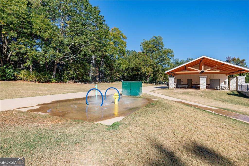 3660 Peachtree Road Northeast, Unit 2H Atlanta, GA 30319 - Photo 35 of 56 a front view of a house with a yard