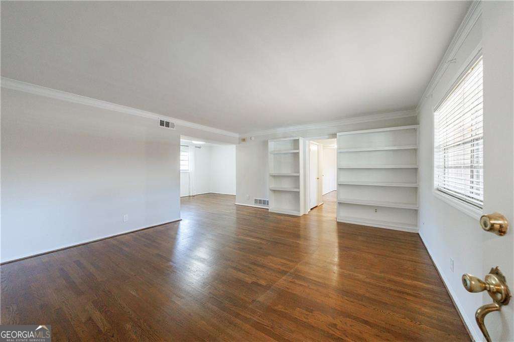 3660 Peachtree Road Northeast, Unit 2H Atlanta, GA 30319 - Photo 5 of 56 wooden floor in an empty room with a window