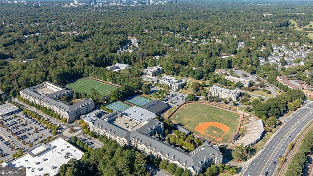 3660 Peachtree Road Northeast, Unit 2H Atlanta, GA 30319 - Photo 51 of 56 an aerial view of a house with a swimming pool and lake view
