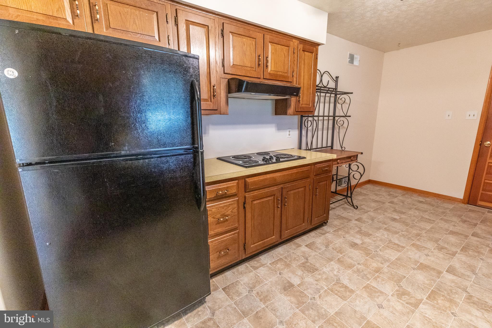 175 Camp Frame Road Hedgesville, WV 25427 - Photo 11 of 57 Large kitchen w/ oak cabinetry and vinyl flooring