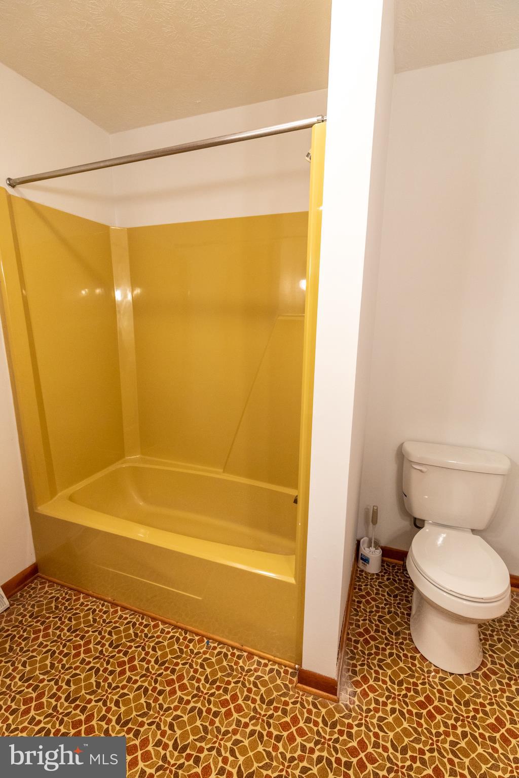 175 Camp Frame Road Hedgesville, WV 25427 - Photo 24 of 57 Hall bath with vinyl floors and tub/shower combo