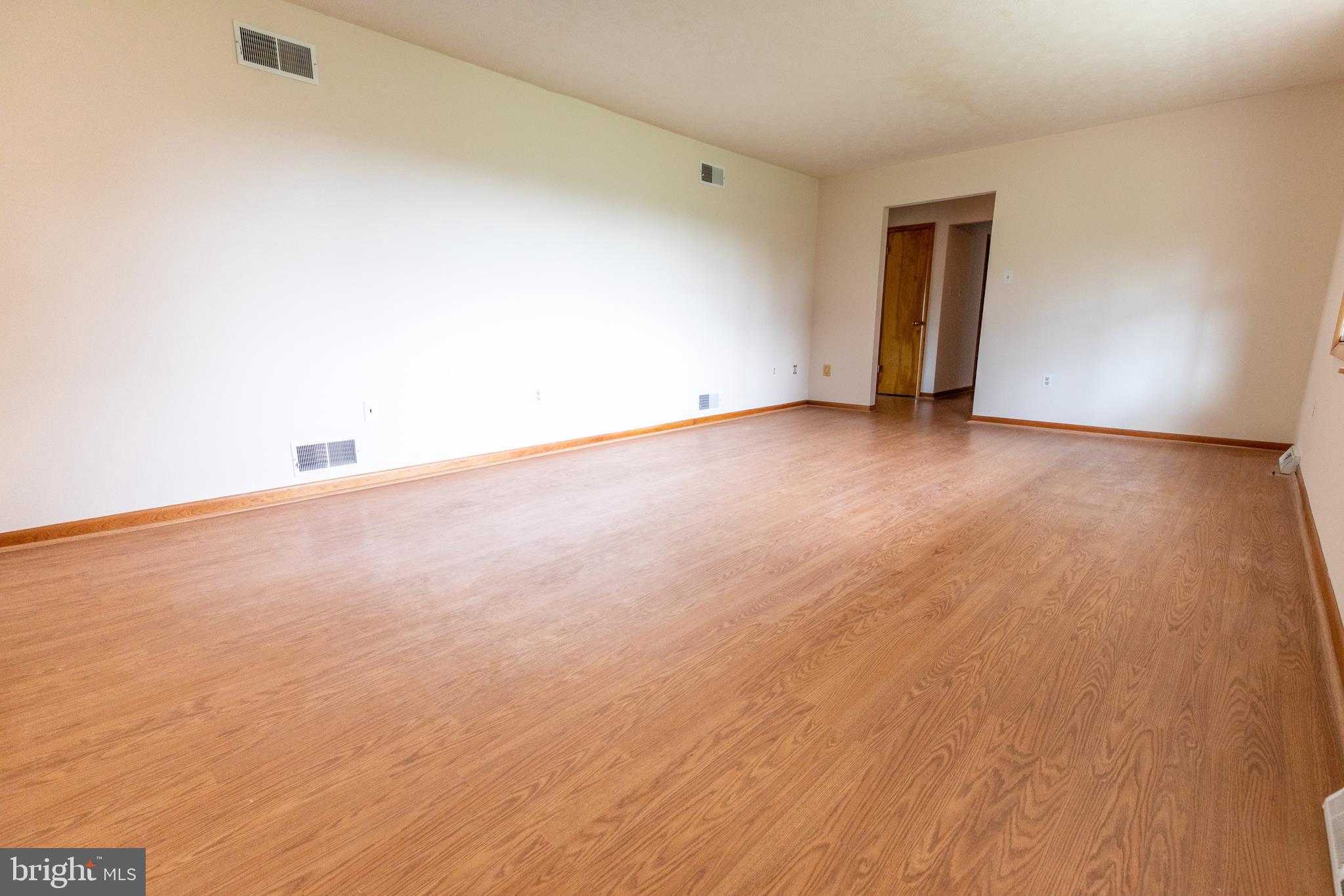 175 Camp Frame Road Hedgesville, WV 25427 - Photo 7 of 57 W/ neutral paint on the walls + laminate flooring