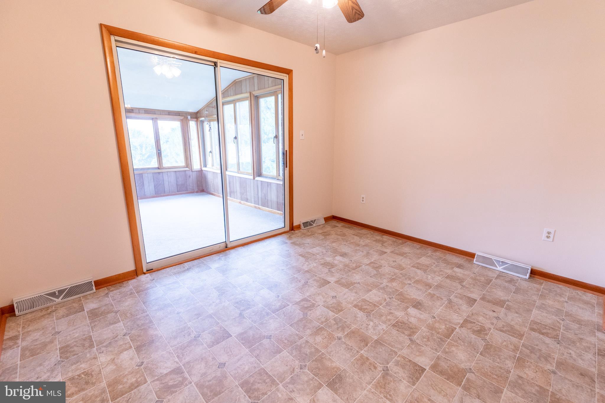 175 Camp Frame Road Hedgesville, WV 25427 - Photo 10 of 57 Large glass doors grant you access to the sunroom