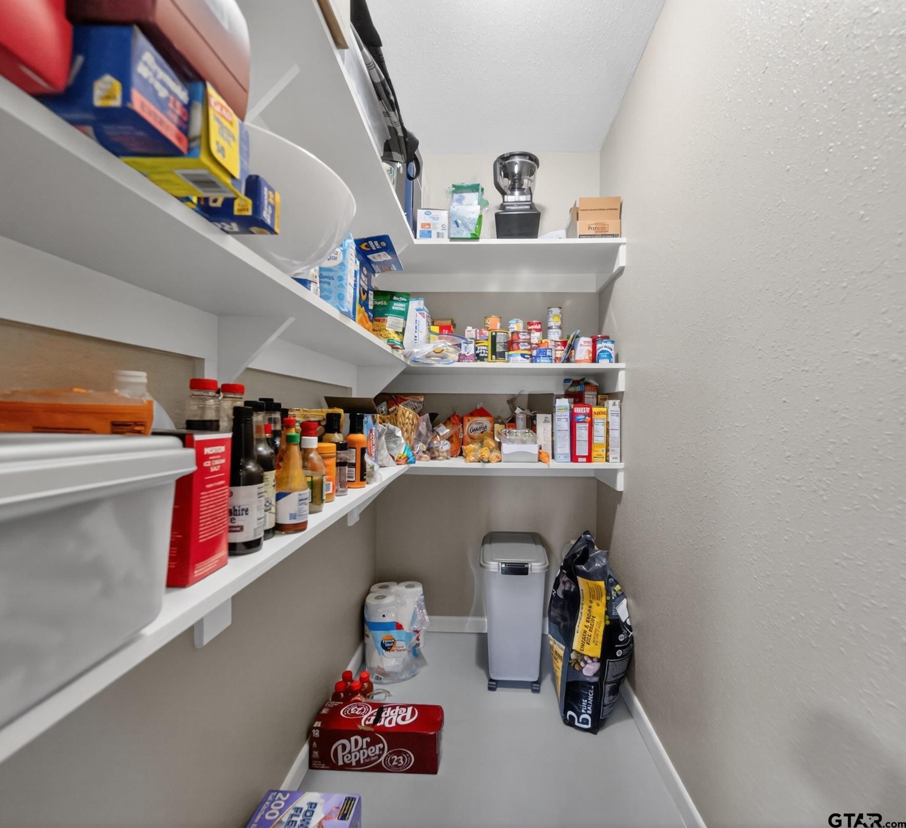 720 Wilma Street Tyler, TX 75701 - Photo 17 of 41 a storage room with lots of clutter and storage