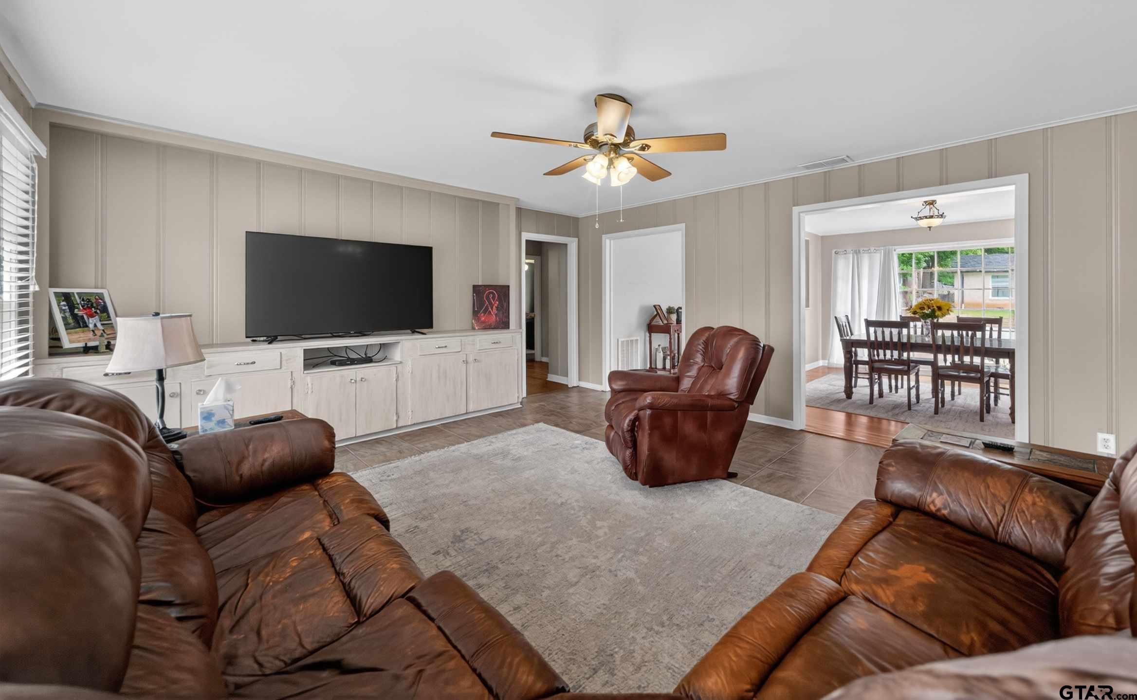 720 Wilma Street Tyler, TX 75701 - Photo 19 of 41 a living room with furniture and a flat screen tv