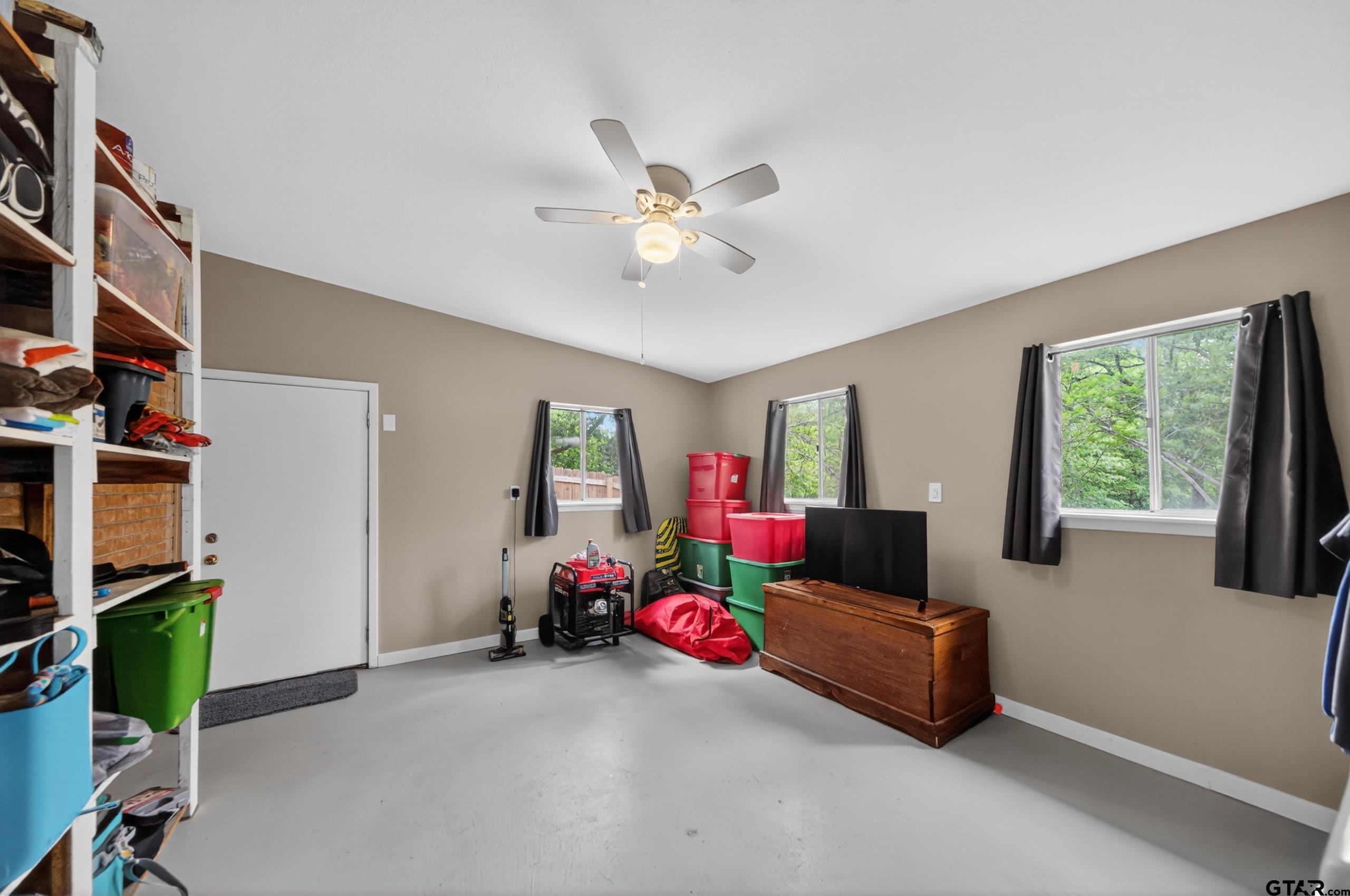 720 Wilma Street Tyler, TX 75701 - Photo 33 of 41 a living room with furniture and a window