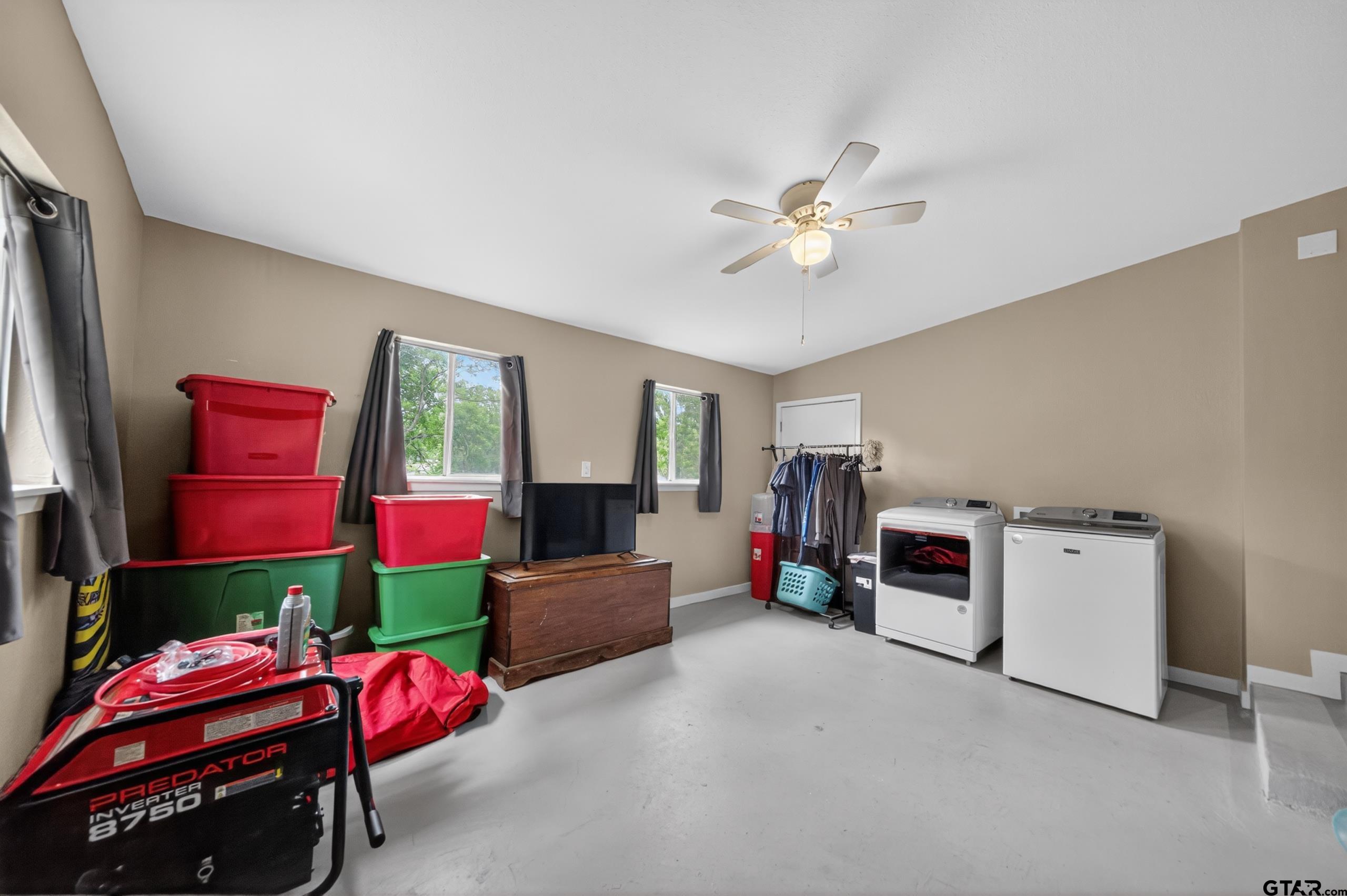720 Wilma Street Tyler, TX 75701 - Photo 34 of 41 a living room with furniture and a flat screen tv