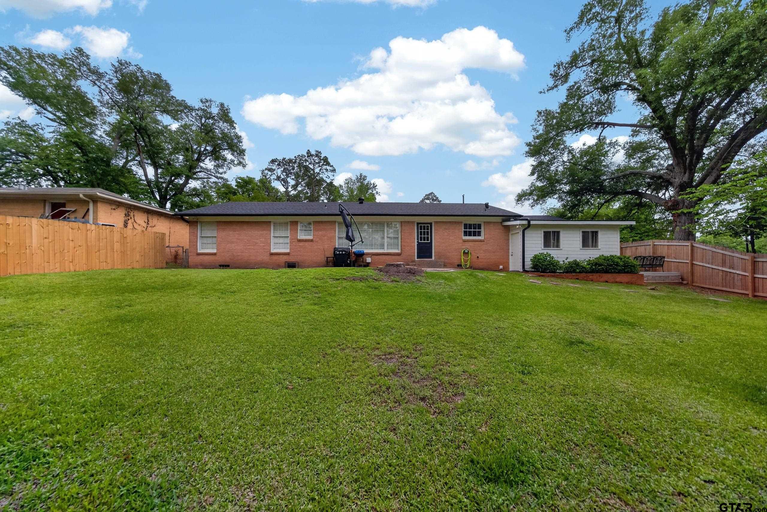 720 Wilma Street Tyler, TX 75701 - Photo 39 of 41 a view of house with backyard