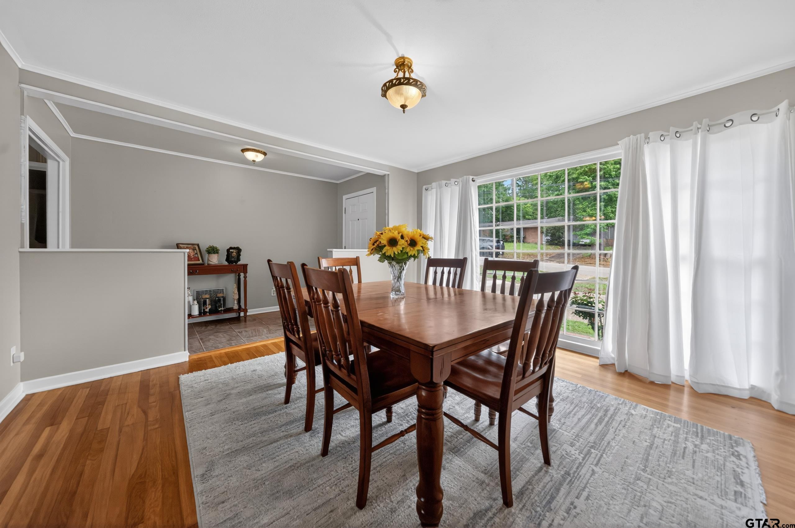 720 Wilma Street Tyler, TX 75701 - Photo 9 of 41 a view of a dining room with furniture and wooden floor