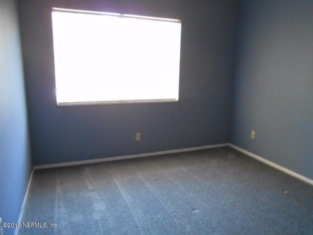 4810 Evenlode Lane Jacksonville, FL 32217 - Photo 16 of 21 an empty room with a window