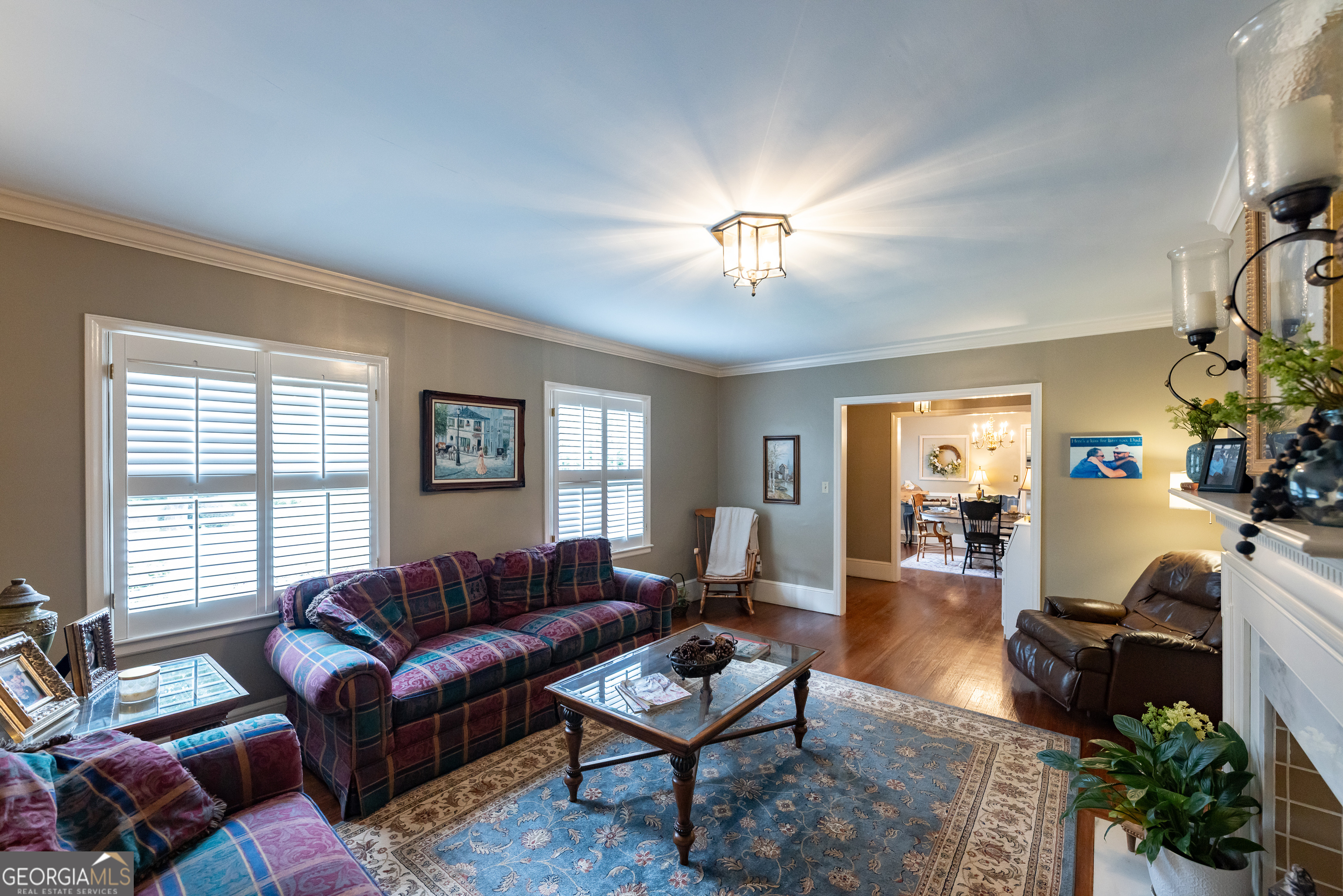 314 Cherokee Road Thomaston, GA 30286 - Photo 11 of 46 a living room with furniture a chandelier and a window