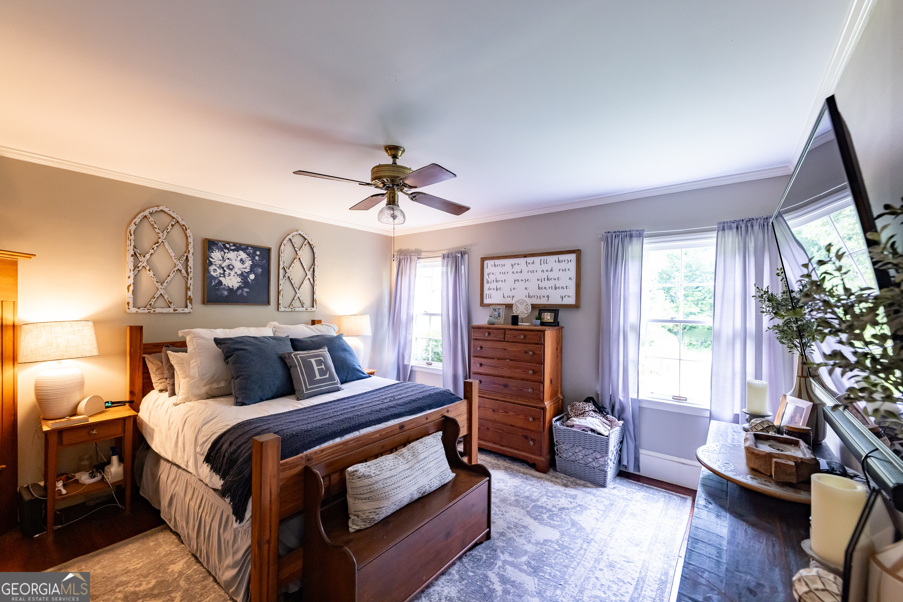 314 Cherokee Road Thomaston, GA 30286 - Photo 12 of 46 a bedroom with a bed and a chandelier