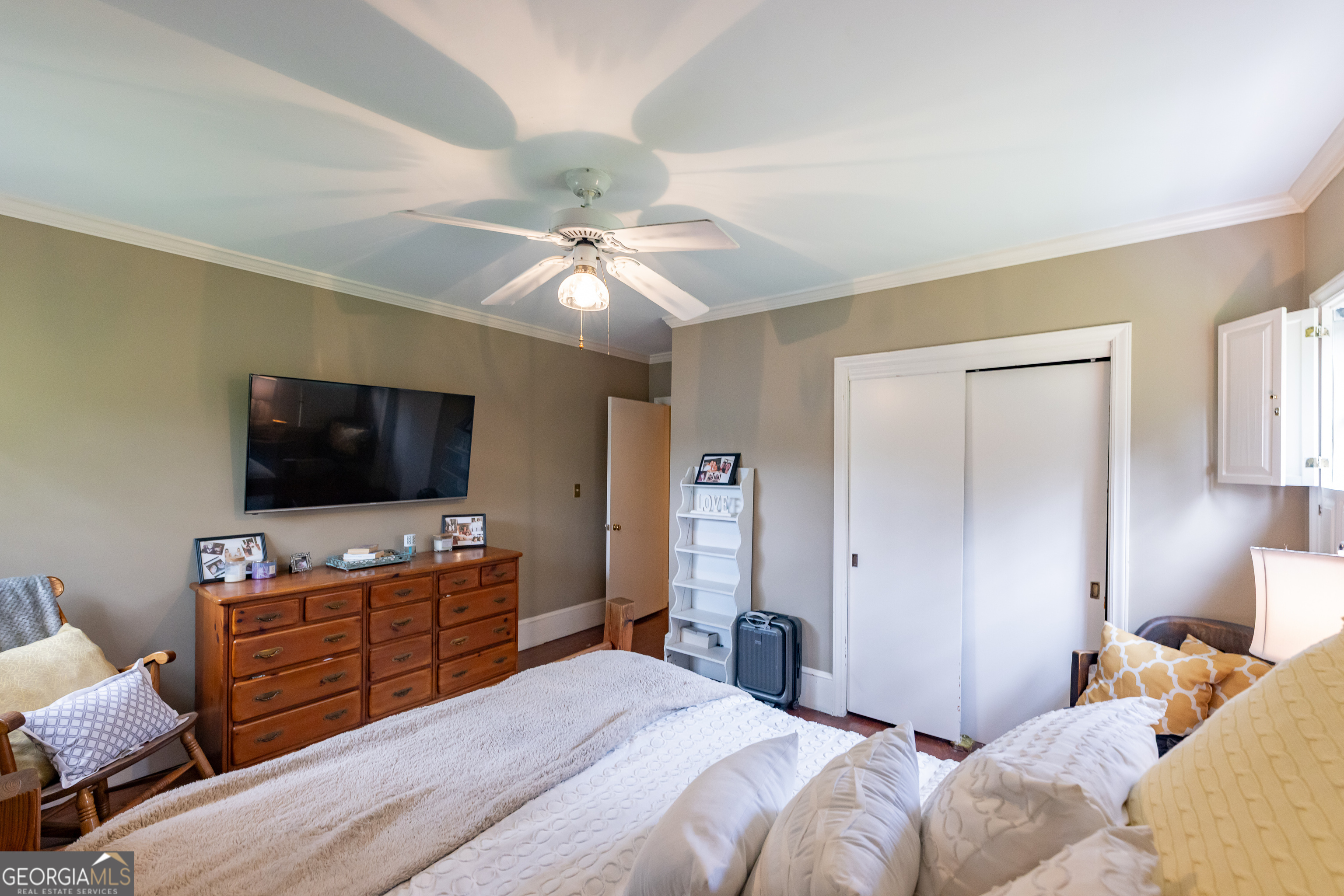 314 Cherokee Road Thomaston, GA 30286 - Photo 18 of 46 a bedroom with a bed and a flat screen tv