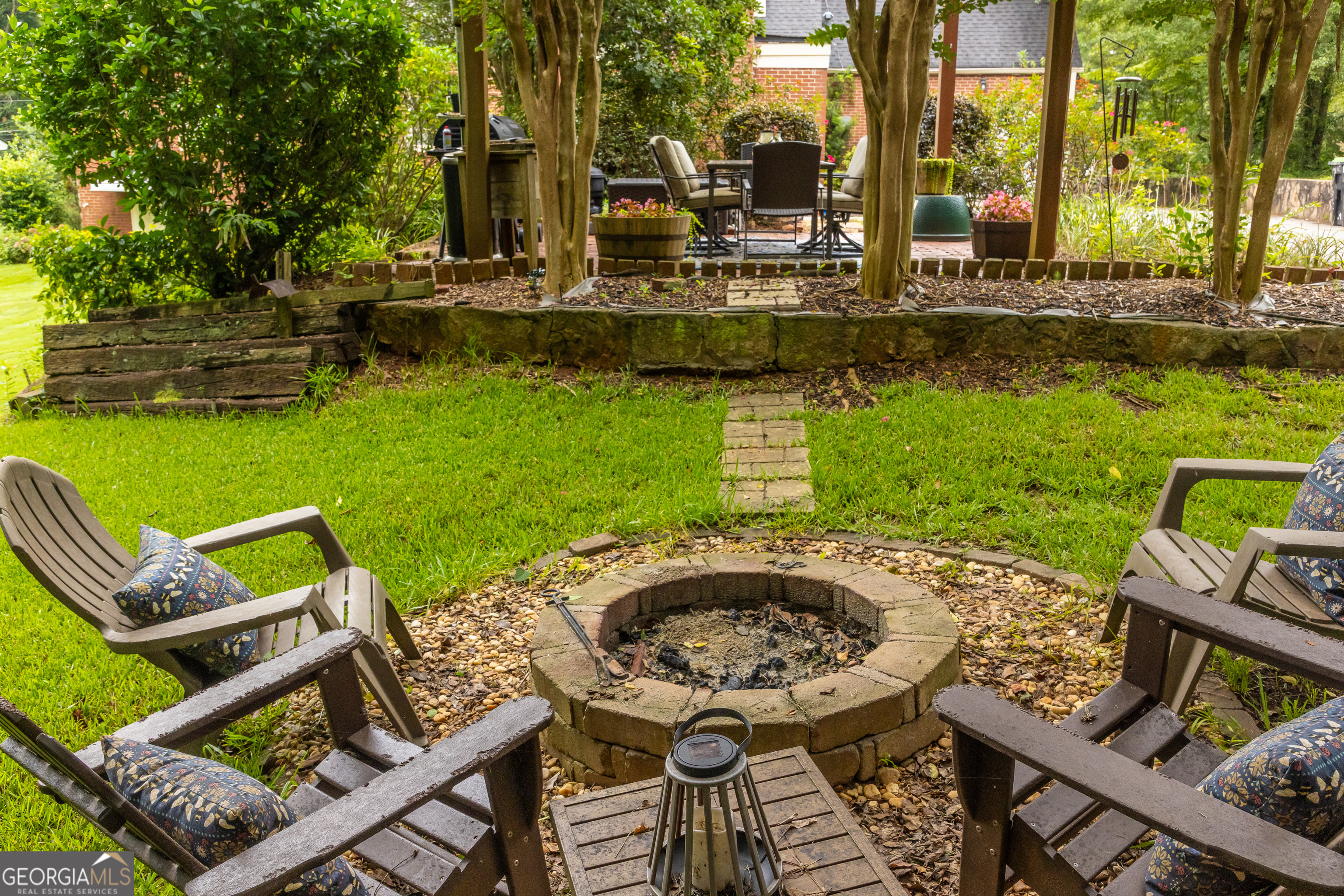 314 Cherokee Road Thomaston, GA 30286 - Photo 2 of 46 a view of yard with seating area and trees around