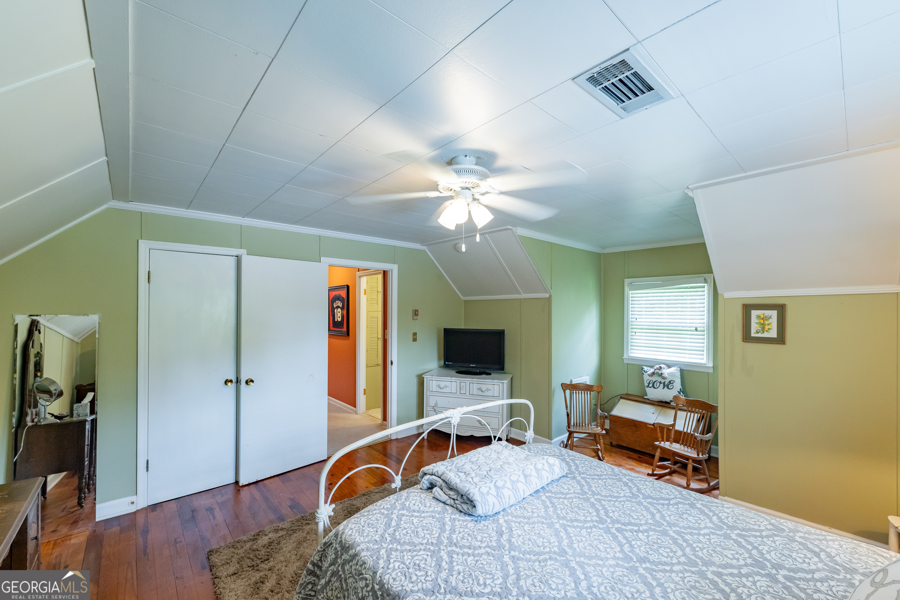 314 Cherokee Road Thomaston, GA 30286 - Photo 23 of 46 a bedroom with furniture and a chandelier