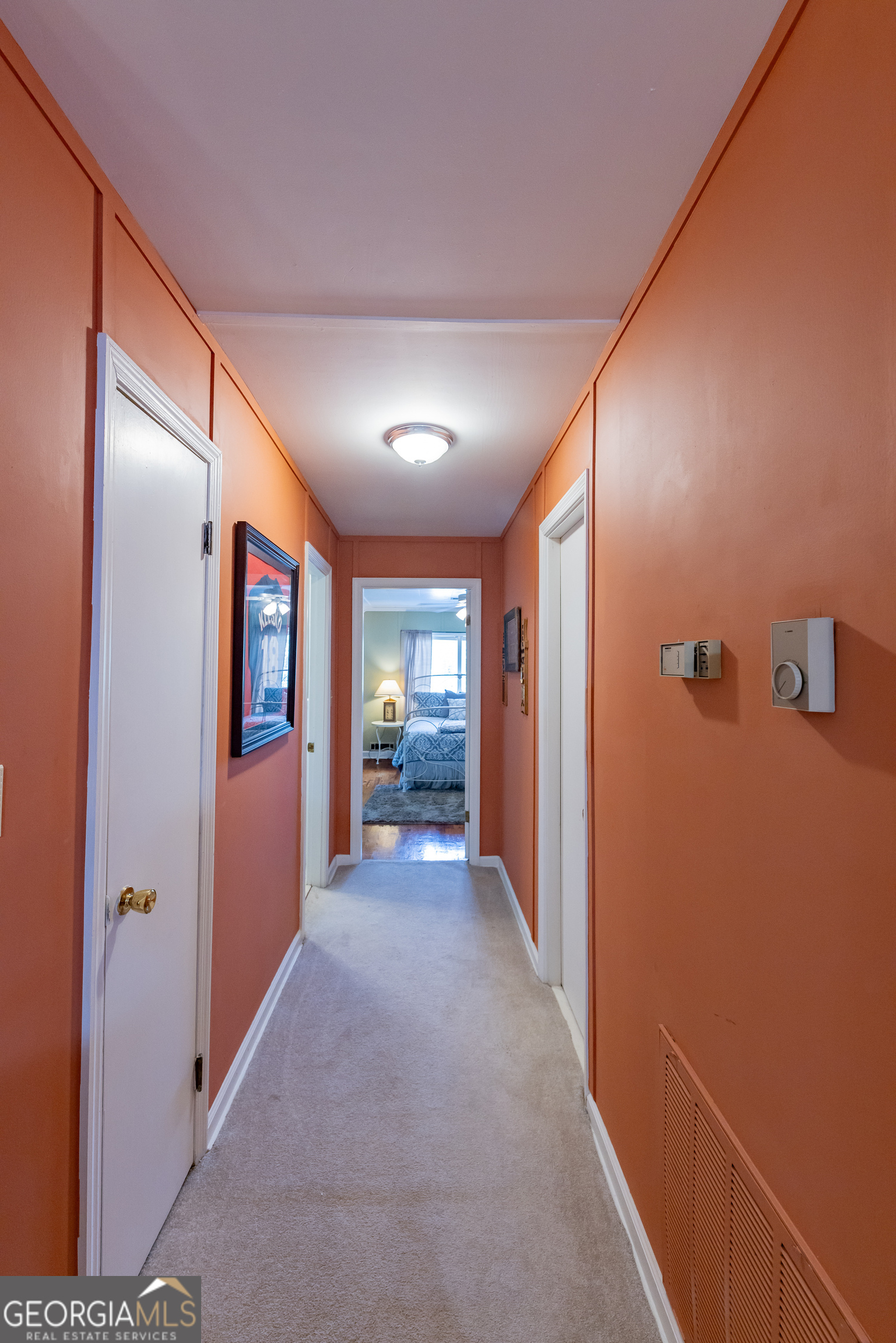 314 Cherokee Road Thomaston, GA 30286 - Photo 24 of 46 a view of a hallway with wooden floor and staircase