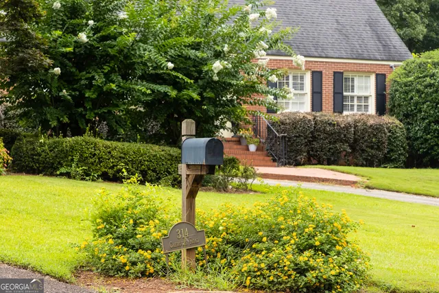 a swimming pool with some trees in the background