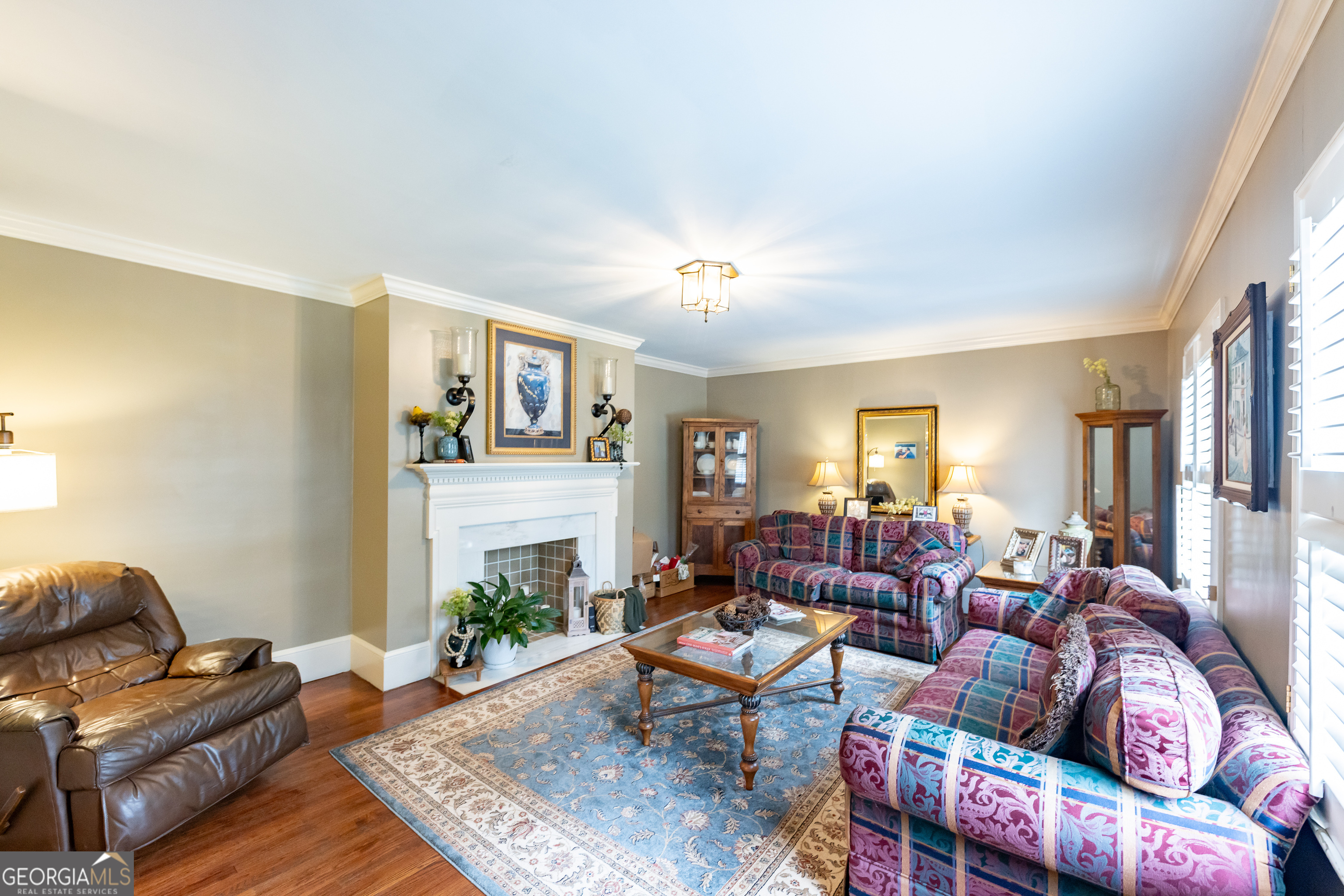 314 Cherokee Road Thomaston, GA 30286 - Photo 10 of 46 a living room with furniture and a fireplace