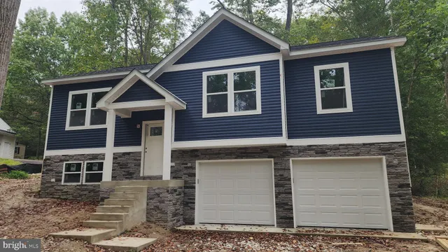 a front view of a house with garage
