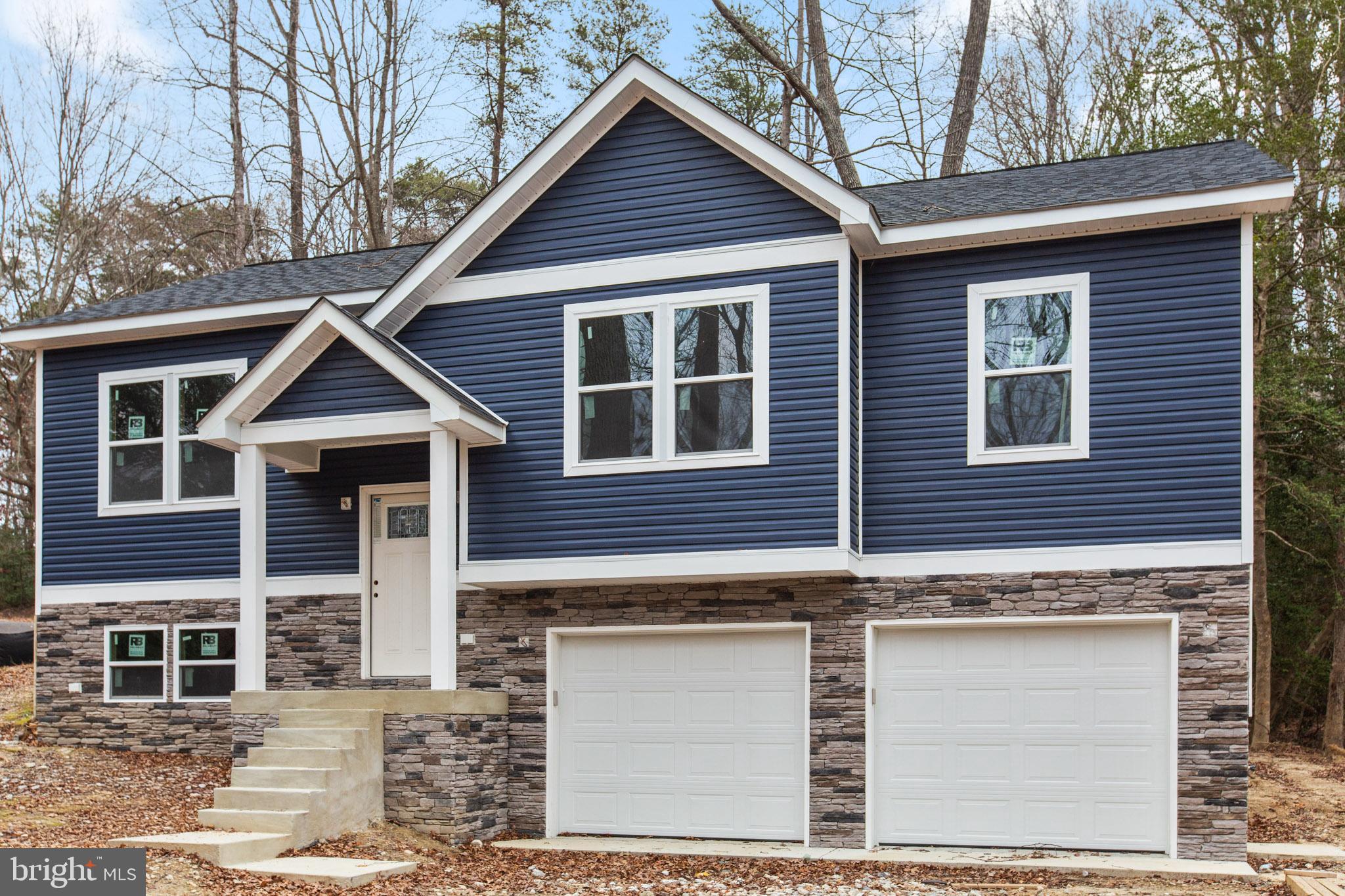 23570 Myrtle Point Road California, MD 20619 - Photo 13 of 18 a view of a house with a yard