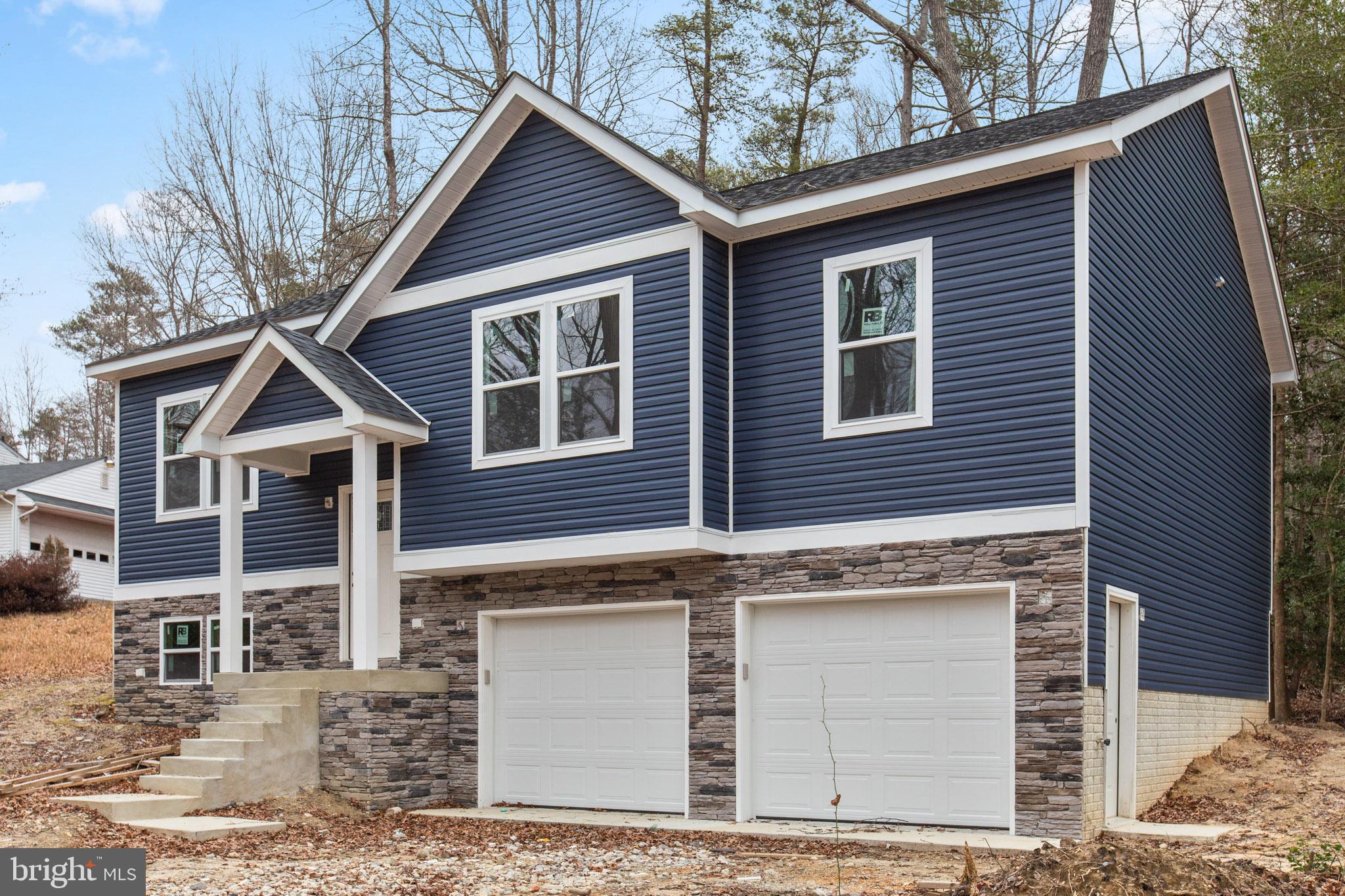 23570 Myrtle Point Road California, MD 20619 - Photo 14 of 18 a view of a house with a yard