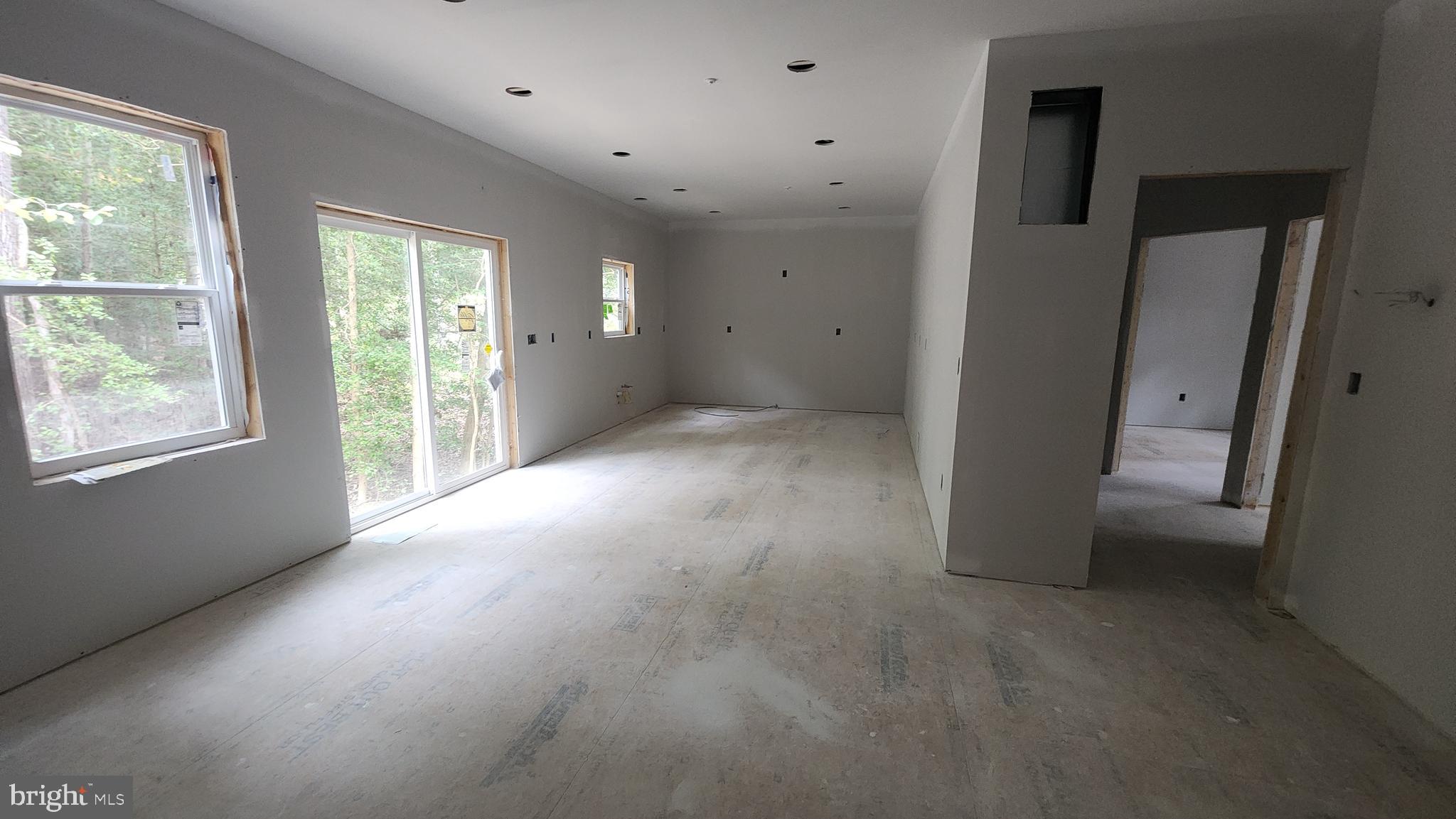 23570 Myrtle Point Road California, MD 20619 - Photo 3 of 10 an empty room with windows