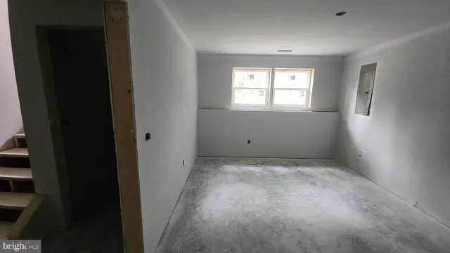 an empty room with windows