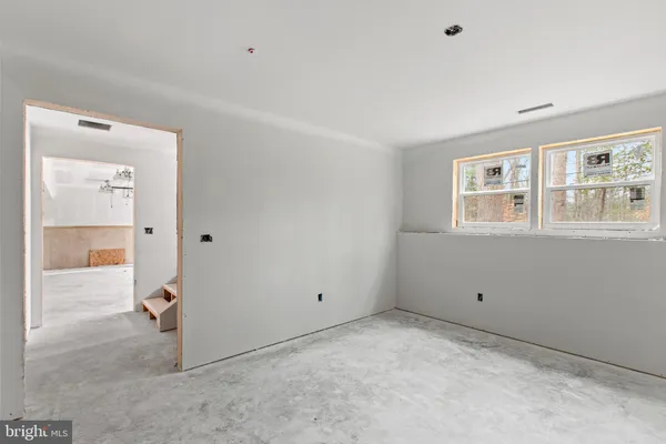 a view of empty room with windows