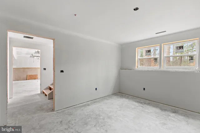 a view of empty room with windows