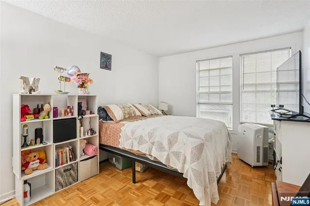 a bed room with a bed and a window