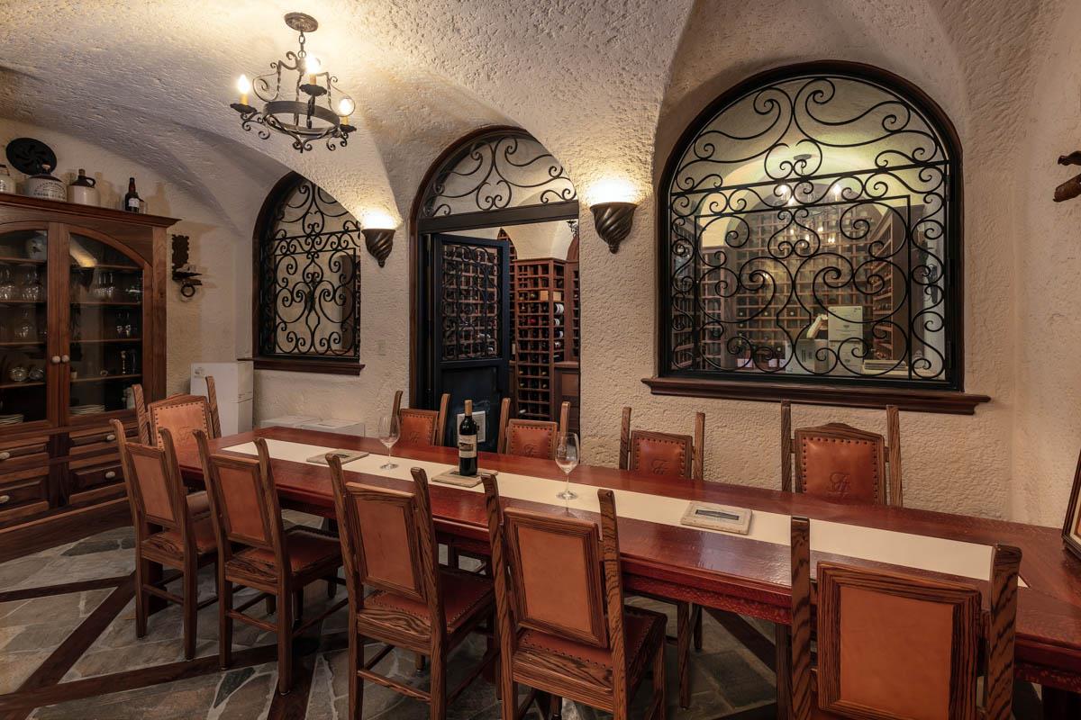 5660 Alpine Road Portola Valley, CA 94028 - Photo 15 of 39 a dining room with furniture a chandelier and wooden floor