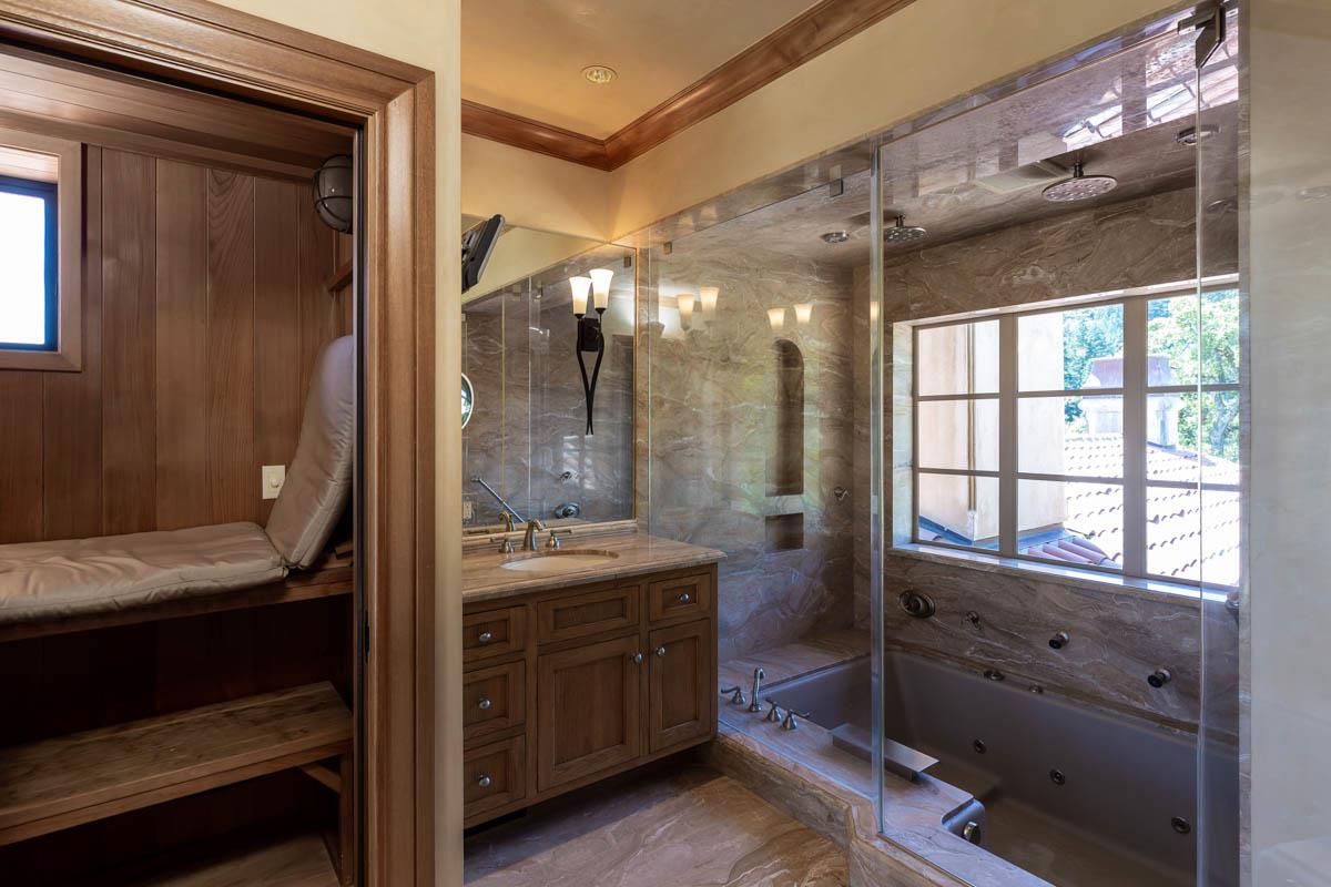 5660 Alpine Road Portola Valley, CA 94028 - Photo 27 of 39 a bathroom with a granite countertop sink a mirror and shower