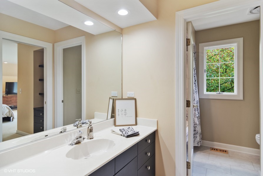 930 Muirfield Road Inverness, IL 60067 - Photo 29 of 48 a bathroom with a sink and a mirror