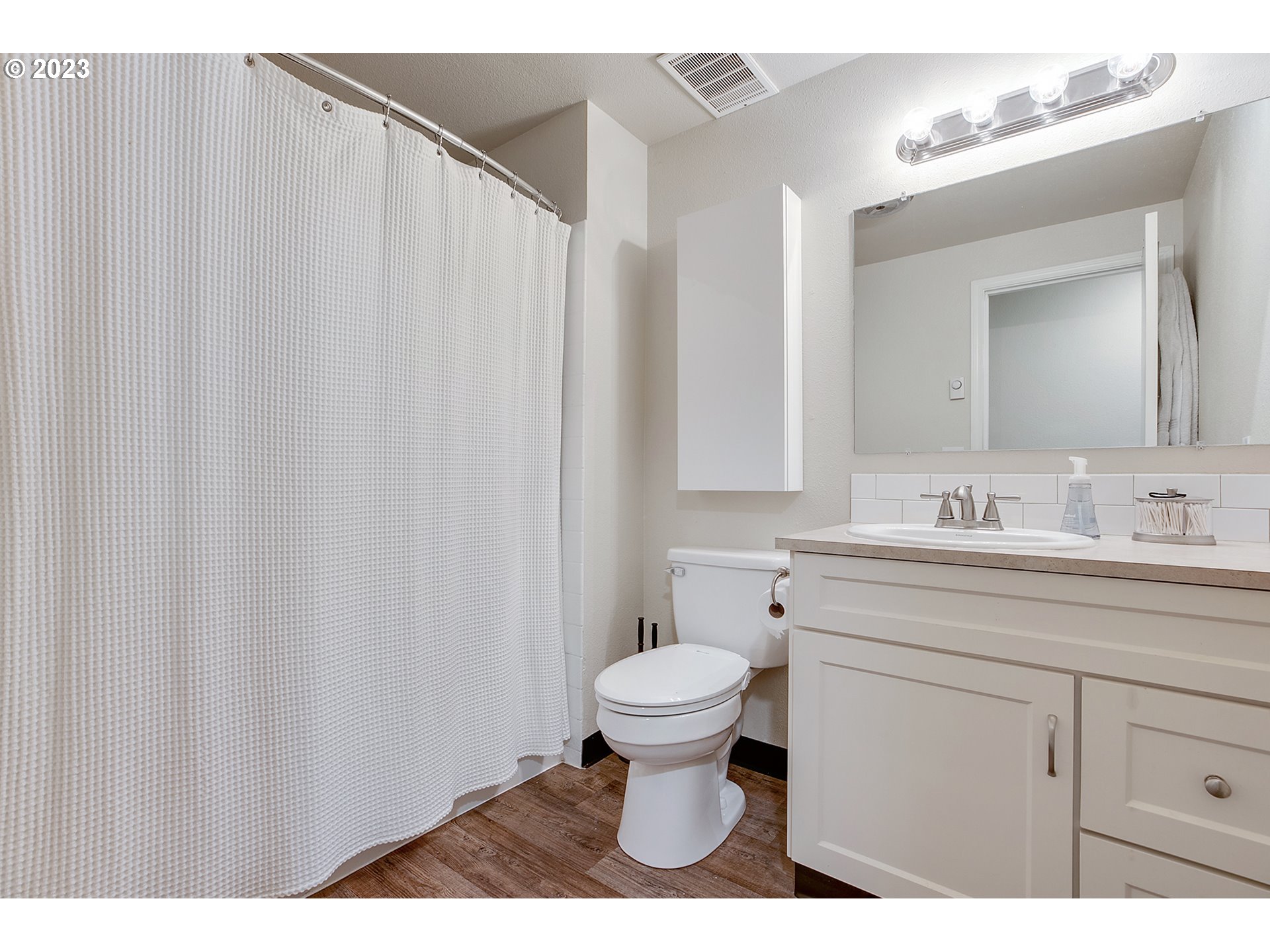 1802 Northwest 105th Street Vancouver, WA 98685 - Photo 16 of 23 a bathroom with a sink a toilet and a mirror