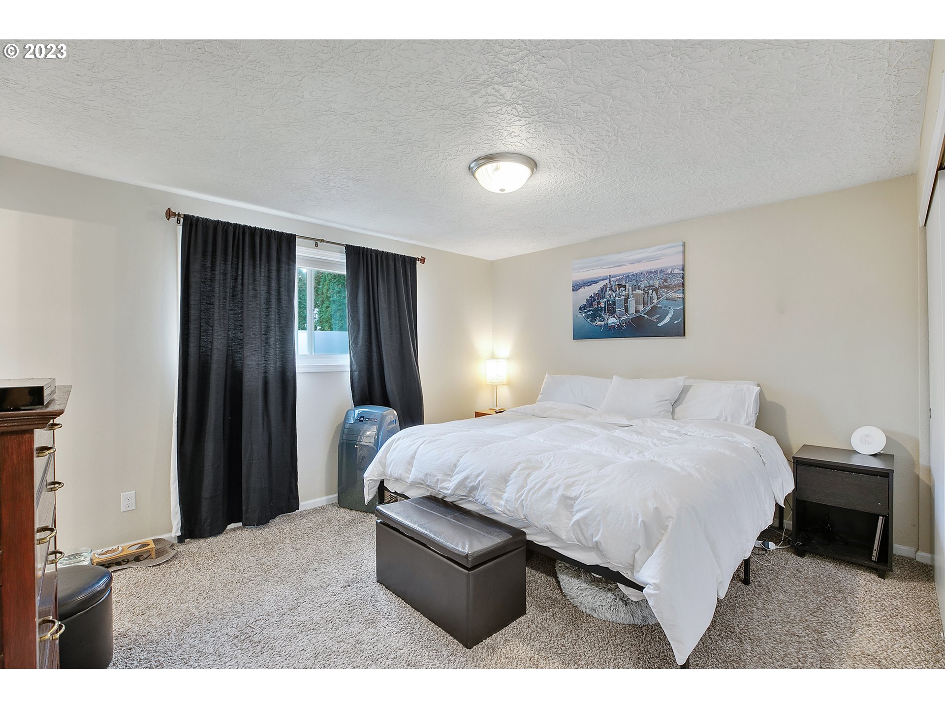 1802 Northwest 105th Street Vancouver, WA 98685 - Photo 18 of 23 a bedroom with a bed and a painting on the wall