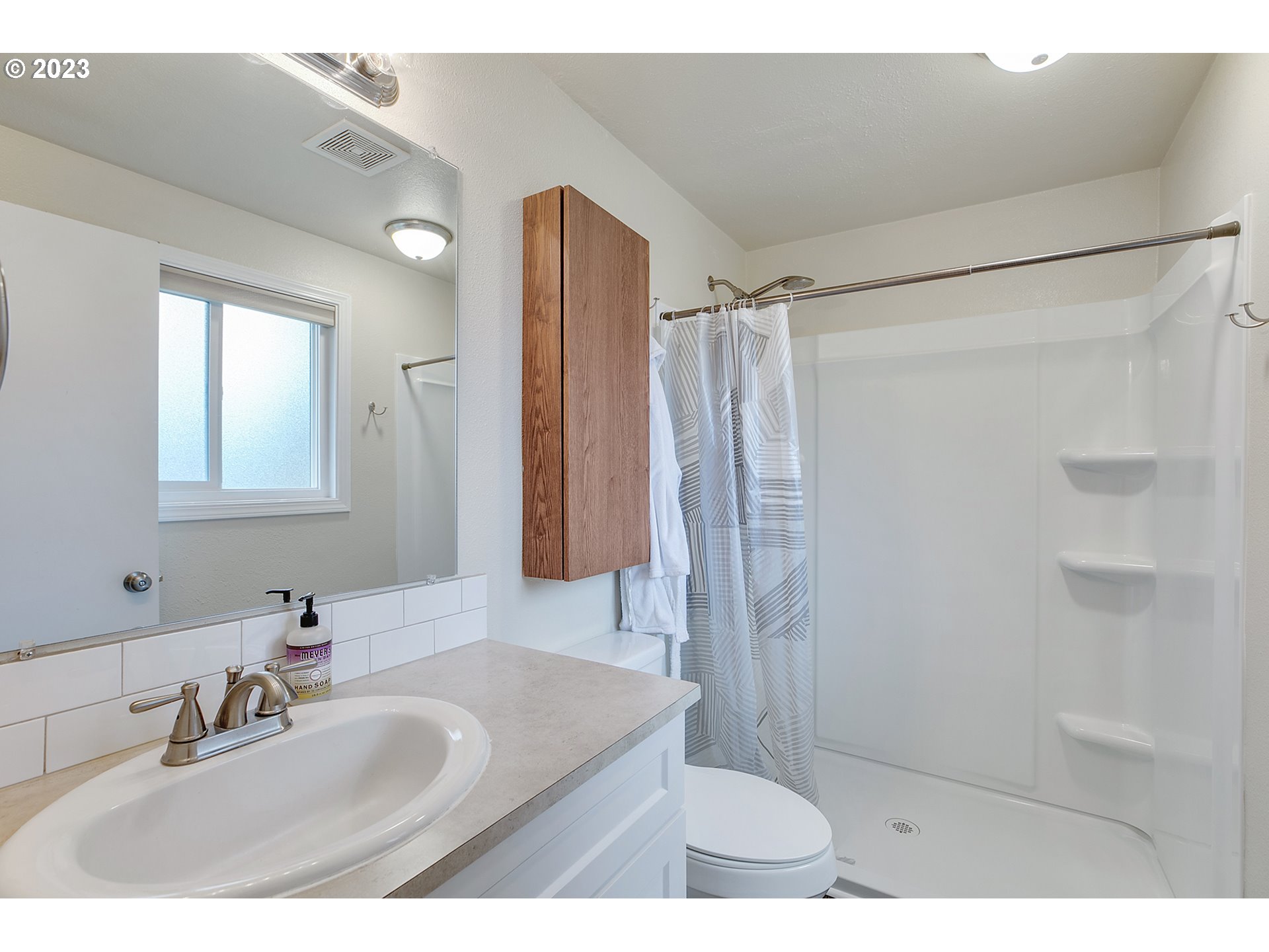 1802 Northwest 105th Street Vancouver, WA 98685 - Photo 20 of 23 a bathroom with a sink and a mirror