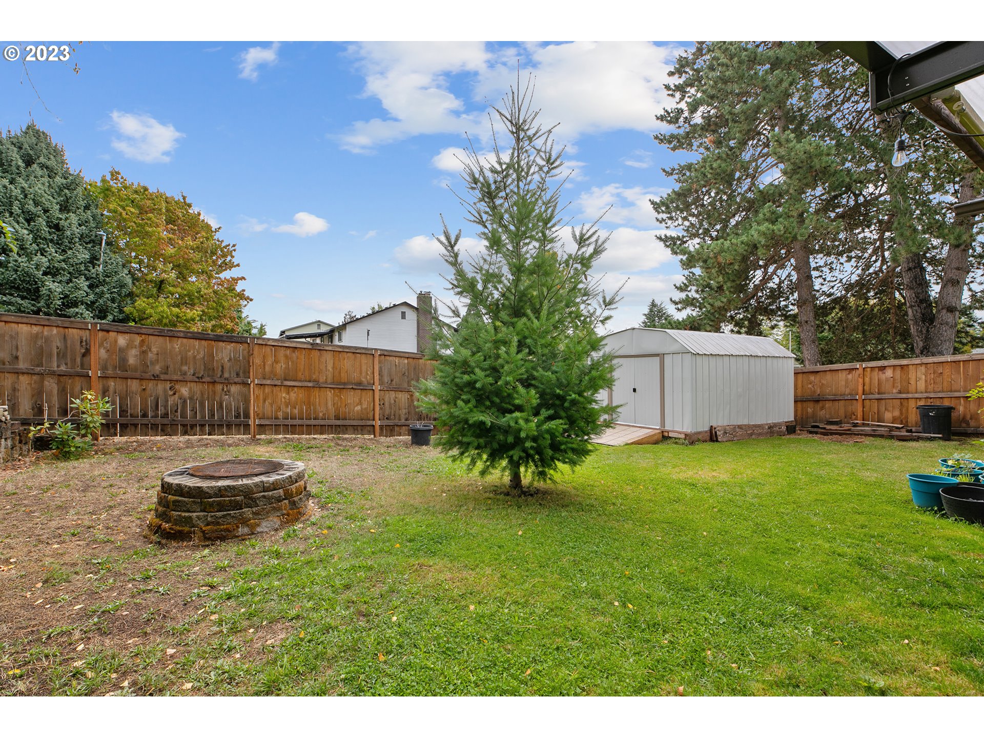 1802 Northwest 105th Street Vancouver, WA 98685 - Photo 23 of 23 a backyard of a house with table and chairs