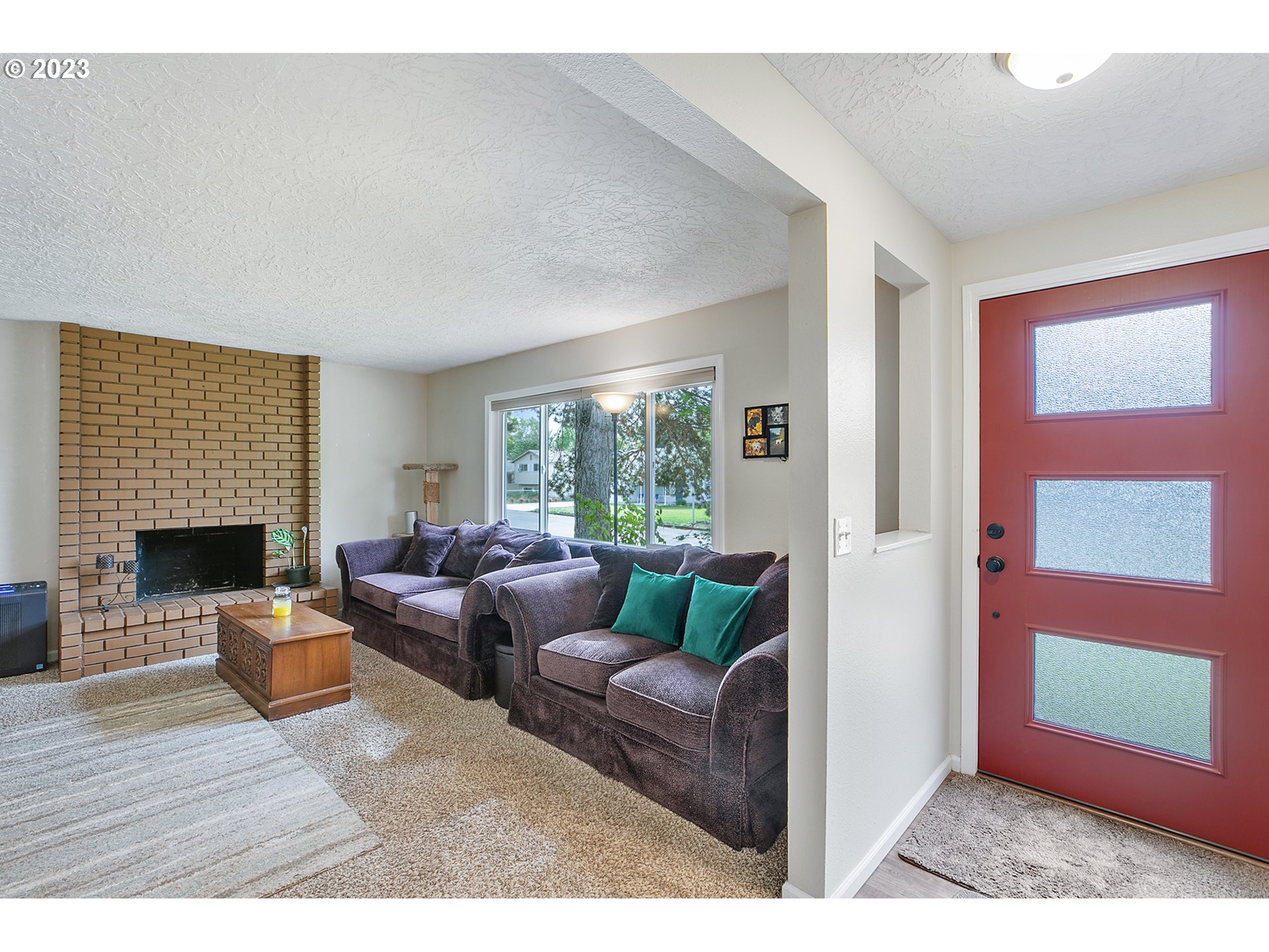 1802 Northwest 105th Street Vancouver, WA 98685 - Photo 4 of 23 a living room with furniture a fireplace and a window
