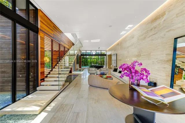 a view of a patio with a table chairs and a potted plant